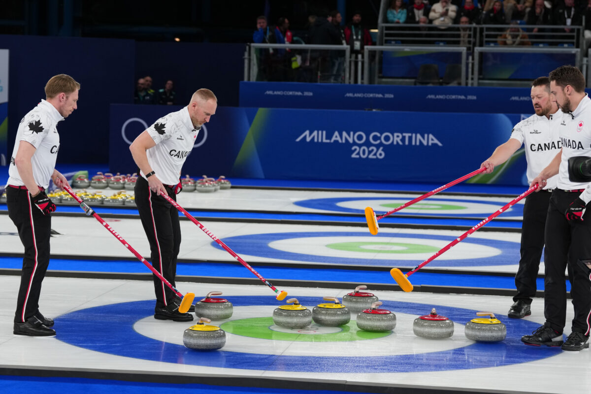 Canada's Brett Gallant, Brad Jacobs, Marc Kennedy, Tyler Tardi compete during a men's curling gold medal match between Britain and Canada, at the 2026 Winter Olympics in Cortina d'Ampezzo, Italy, on Saturday, Feb. 21, 2026. (AP Photo/Misper Apawu)